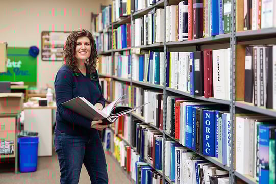 img_katie-in-product-library-looking-at-book