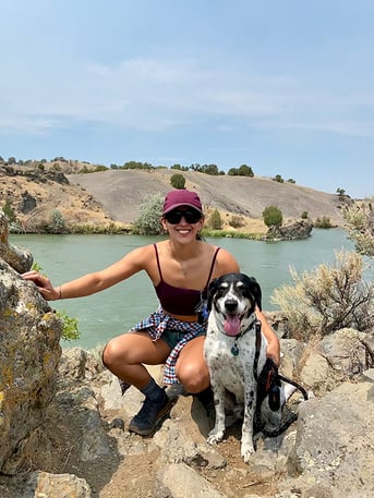 img_brianna-by-river-with-dog