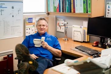 Larry Farley with a toilet mug
