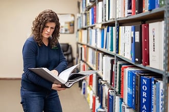 img_katie-in-library-looking-down